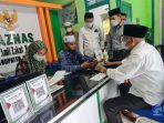 Bupati Asahan Serahkan Zakat ke Baznas