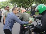Solidaritas Bapenda Kota Medan Bagikan 1.000 Nasi Bungkus untuk Driver Ojol